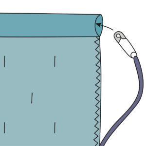 illustration showing yarn with a safety pin stuck on the end being threaded through the…